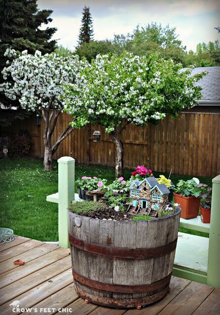 24 repurposed old wine barrel ideas for the garden - 187